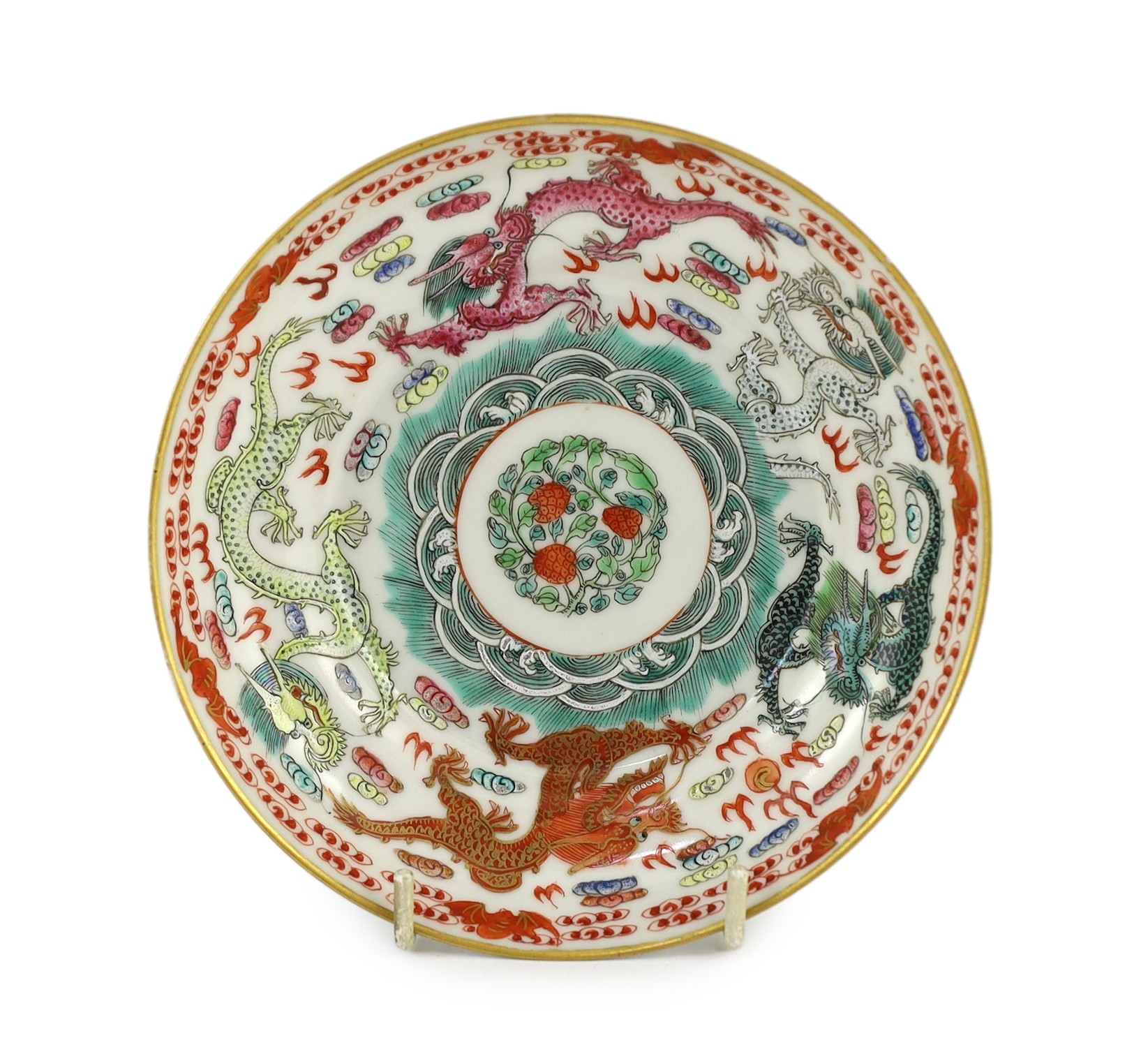 A Chinese famille rose fencai ‘dragon’ saucer dish, Jiaqing four character seal mark, 19th century, 14.6cm diameter